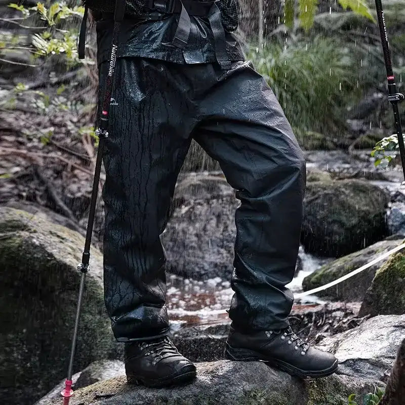 Black waterproof hiking pants with reinforced stitching and a durable, water-resistant fabric.